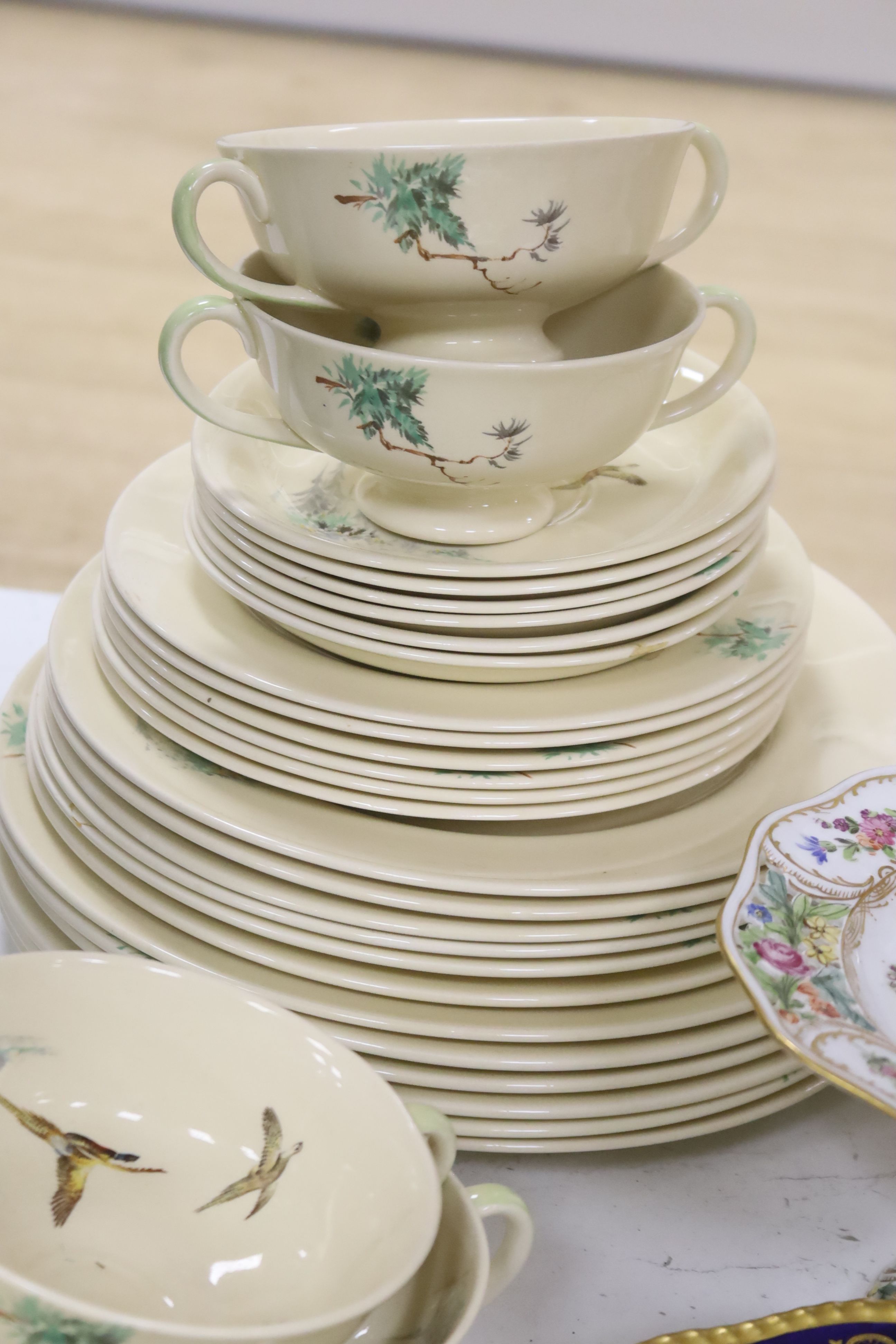 A set of six Coalport game bird plated plates and a Royal Doulton 'The Coppice' pattern part dinner service